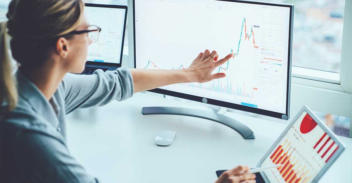 image depicting a woman working on a laptop